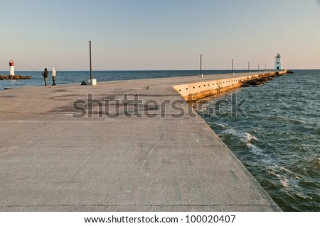 late afternoon sun falls on a local pier
