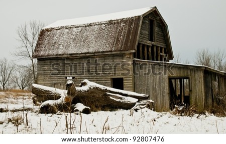 vintage barn under winters grey sky