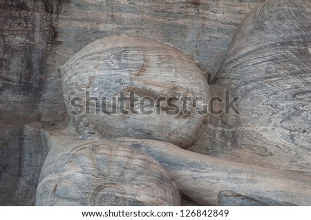 Reclining Buddha statue close up at Gal Vihara, ancient city of Polonnaruwa, Sri Lanka.