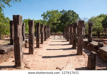 Four row of carved stone pillars ruins in The Council Chamber of King Parakramabahu in ancient city of Polonnaruwa, Sri Lanka. Unesco World Heritage Site.