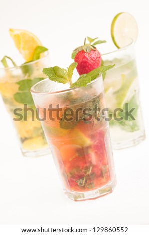 Three colorful variation Mojito cocktails,  Cuban cocktails made from cuban rum, lime, sugar, a splash of soda and flavoured with fresh fruit of your choice