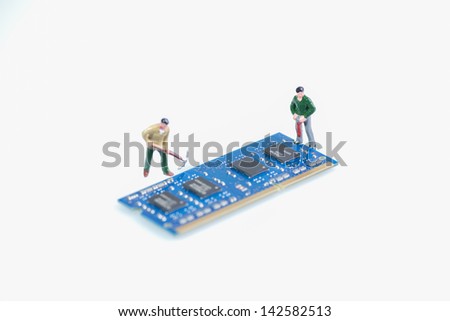 Miniature workmen working on the computer RAM or Random Access Memory part over white background