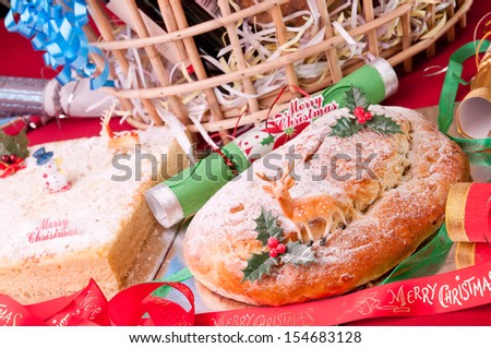 Christmas stollen and coconut cake with hamper basket at the background