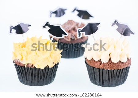 Graduation cupcakes with mortar board picks close up