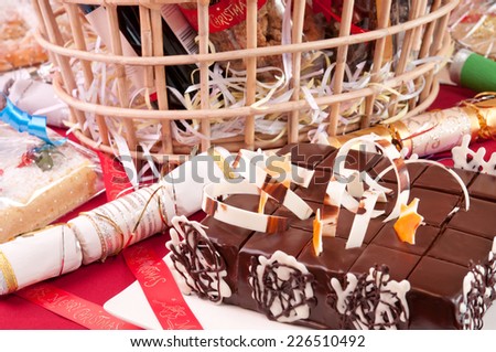 Christmas chocolate cake with a hamper basket at the background