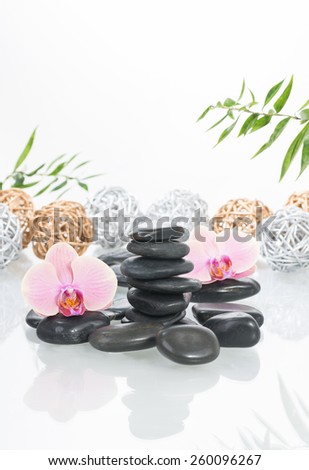 Peach Moth orchids, black zen stones with silver and gold twig balls at the background