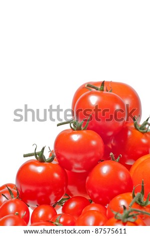 A variety of small, medium and large tomatoes piled up