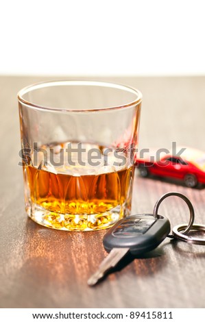 Whiskey neat with a car key indicating don\'t drink and drive