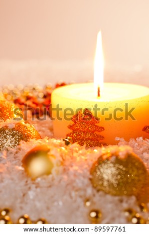 Gold Christmas concept on snow with pine cones and gold decorations