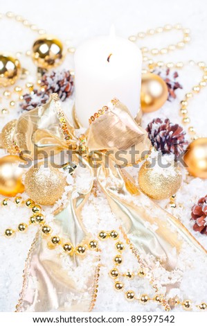 Gold Christmas theme on snow with pine cones and gold decorations