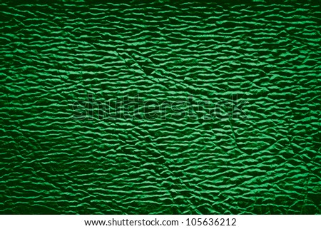 green leather background with white light reflexes