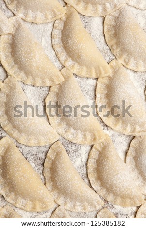 raw dumplings filled with cheese or food background