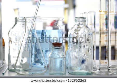 laboratory glass with liquid inside, chemistry lab
