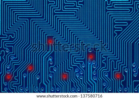 blue printed circuit board or abstract background with red lighting points