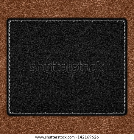 black leather background on brown grain texture