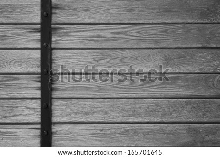 wooden planks background with black metal bar on left side or grey wood grain texture