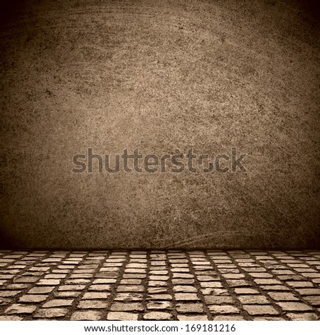 black scratched wall and grey cobblestone street background or abstract stage
