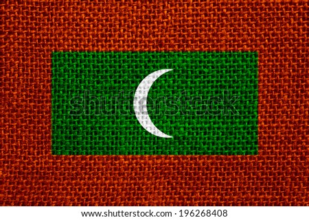 flag of Maldives or banner Dhivehi on linen background