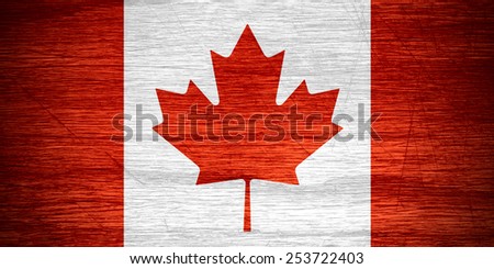 Canada flag or Canadian banner on wooden texture