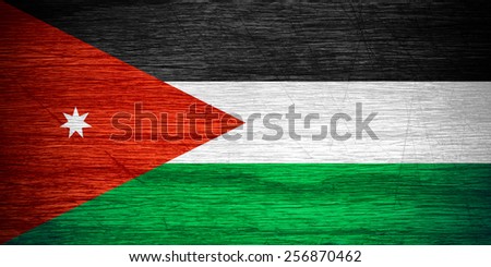 Jordan flag or Jordanian banner on wooden texture