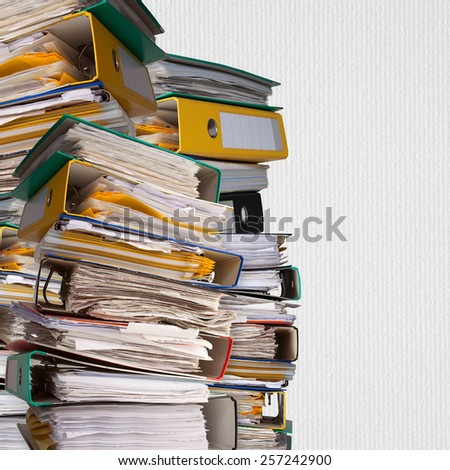 piles of file binder with documents on white paper background