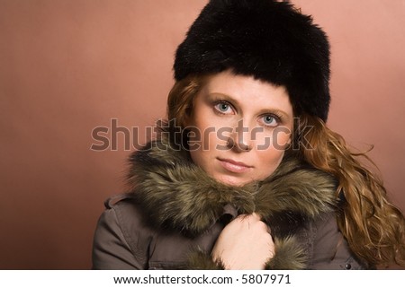 Attractive woman with warming clothes. Winter is coming