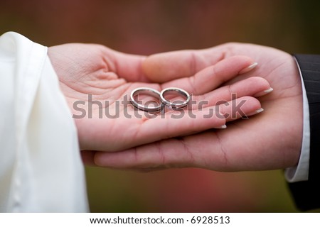 stock photo Weddingrings in the palms of the married couple Small DOF