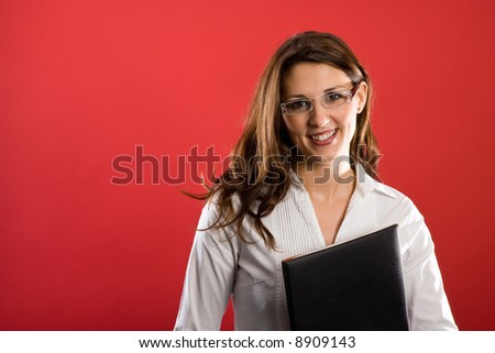 Female secretary is smiling to you. Appealing and simpatico.