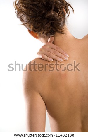 stock photo Woman from behind naked body holding her neck on the left