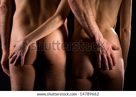 stock photo Rear view of naked couple where the hands are on the others 