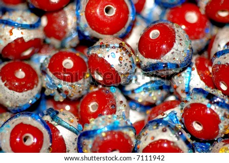 the red,blue,silver  round beads from glass