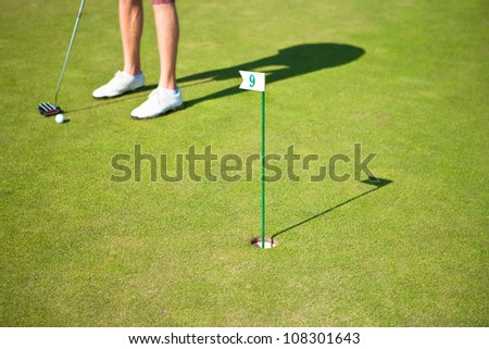 Golf player training a par before actual golf game