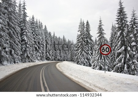 60 kilometers per hour speed limit sign on the serpentine road in Tatra Mountains