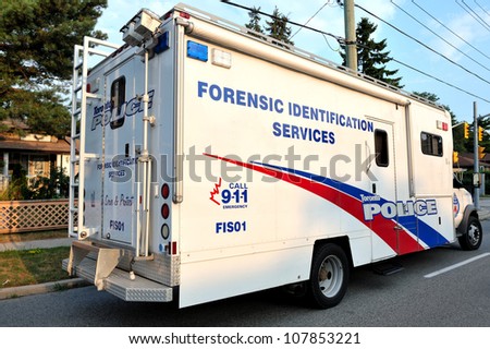 TORONTO-JULY 17: Toronto Forensic Identification Services Unit  at the crime scene where shooting leaves 2 dead and 21 injured on July 17, 2012 in Toronto