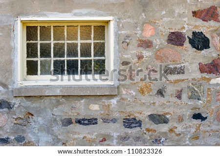 Old Window on a picturesque wall of rocks and stones (your text on right and bellow)