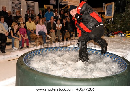 TORONTO - NOVEMBER 9: John Blaicher jumped in a pool of ice to demonstrate cold water survival strategies, at the 