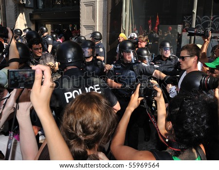 TORONTO-JUNE 25: Police and protesters clash at G20 Protest on June 25, 2010 in Toronto, Canada.