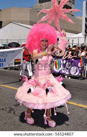 TORONTO - JULY 04: Drag queen dressed in flamingo dress participates in Pride parade in Toronto, July 04, 2010