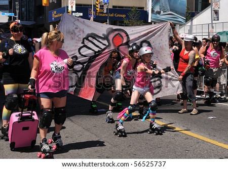 TORONTO - JULY 04: Activist on roller-skates symbolizing a birth of new generation at Pride parade in Toronto, July 04, 2010