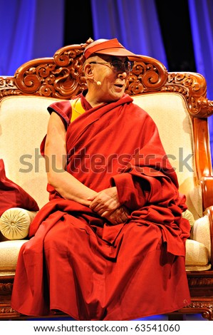 TORONTO-OCTOBER 22: The Dalai Lama, wearing customary robes and a sun visor gave his talk titled Human Approaches to World Peace to 30.000 people on Oct. 22, 2010 in Toronto