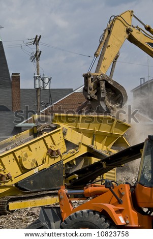 Dump truck, and other heavy duty construction equipment at work