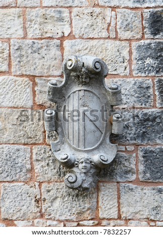 Old stone ornament on the stone wall
