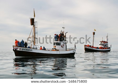 HUSAVIK, ICELAND - AUGUST 16: A group of tourists on two boats to observe whales on August 16, 2008 near Husavik, Iceland.