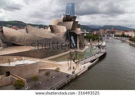 BILBAO, SPAIN - AUGUST 11: The Guggenheim Museum on August 11, 2014 in Bilbao, Spain. Designed by Frank Gehry in 1997 and built alongside the river Nervion, houses collections of contemporary art.
