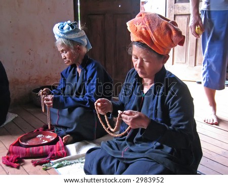 Old women during a sacred ceremony  - Myanmar.