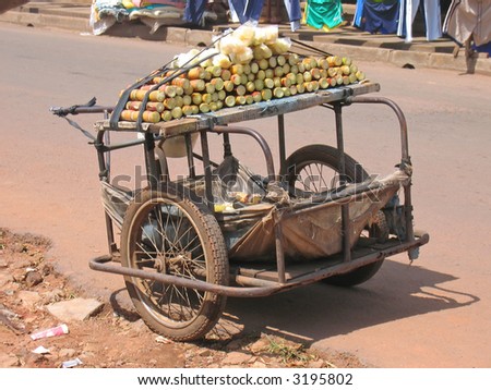 Small rural car with two wheels parked in the street to sell sugar cane - Cameroon - Africa.