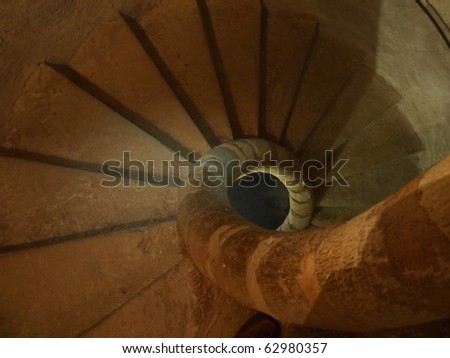 Snail spiral staircase from the top in the french Montrottier castle - France - Architecture.