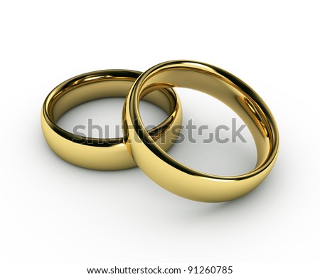 stock photo The beauty wedding gold rings on white background