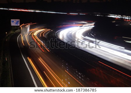 Light trails from headlights and tail lights on the M25 Motorway around London