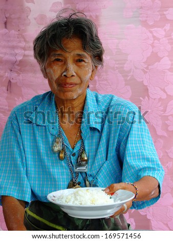 BANGKOK, THAILAND - MAY 1: Old Thai  woman displays hot rice at the market on May 1, 2008 in Bangkok.